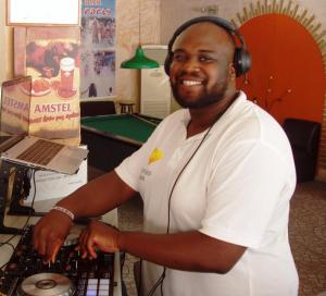 a man wearing headphones standing next to a computer keyboard at Paradise Apartments in Laganas +142 photos