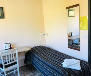 Ein Bett oder Betten in einem Zimmer der Unterkunft Hotelli Anna Kern
