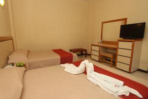 Кровать или кровати в номере HOTEL FERRI