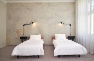 Letto o letti in una camera di Hotel Babula am Augarten