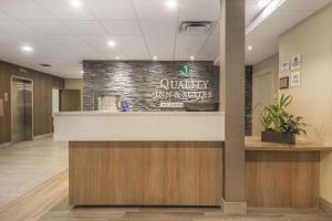 a lobby of a university hospital with a reception counter at Quality Inn & Suites Downtown Windsor, ON, Canada in Windsor