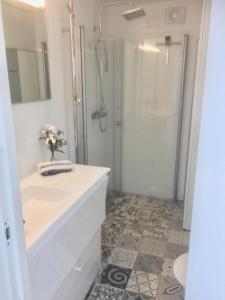 a bathroom with a sink and a shower at Modern Villa in Stockholm Archipelago in Värmdö