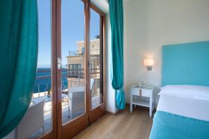 Postel nebo postele na pokoji v ubytování Boutique Hotel Regina + 37 fotografií