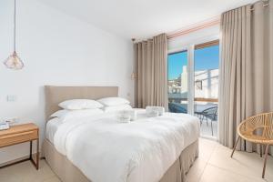 Posteľ alebo postele v izbe v ubytovaní Omnia Mykonos Boutique Hotel & Suites