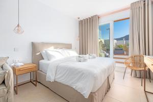 Posteľ alebo postele v izbe v ubytovaní Omnia Mykonos Boutique Hotel & Suites