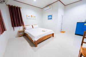Postel nebo postele na pokoji v ubytování Khun Ning Resort