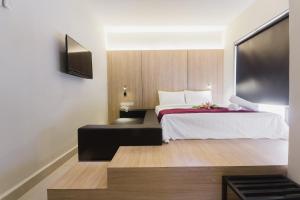 A bed or beds in a room at GM Hotel Kuantan