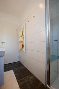 a bathroom with a shower and a sink at Jann-Berghaus-Straße 29 in Norderney