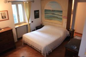 Una cama o camas en una habitación de B&b al Borgo