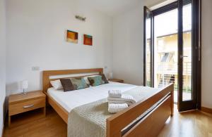 A bed or beds in a room at Apartment Alessandra