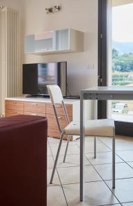 Televízia a/alebo spoločenská miestnosť v ubytovaní Apartment Alessandra