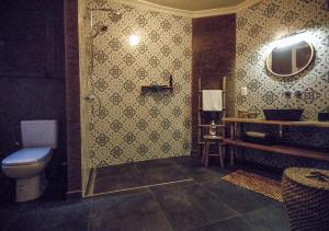 a bathroom with a toilet and a sink and a mirror at SLEEP INN - 1001 Nights Loft Citycenter with Balconyview in Antwerp +38 photos