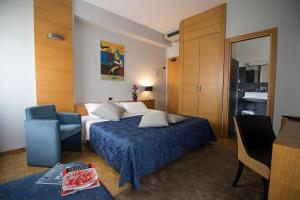 Ένα ή περισσότερα κρεβάτια σε δωμάτιο στο Hotel Clarici