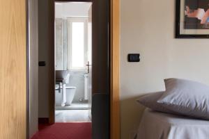 Koupelna v ubytování Hotel Clarici + 37 fotografií