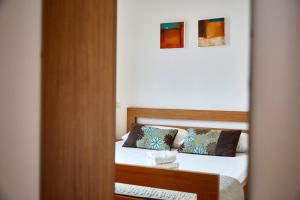 A bed or beds in a room at Apartment Alessandra