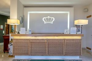 a bar with a crown on top of it at Hotel Regina in Sorrento
