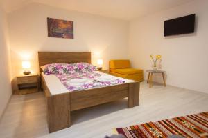 Postel nebo postele na pokoji v ubytování Apartments Daris + 39 fotografií