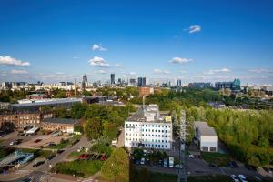 an aerial view of a city with buildings and trees at Apartments Parks of Warsaw by Renters in Warsaw