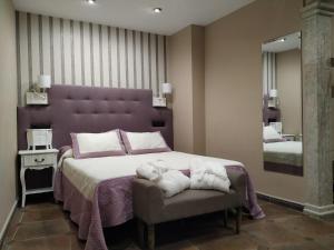 Posteľ alebo postele v izbe v ubytovaní Hotel Arcos Catedral