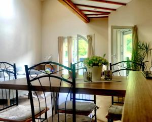 a dining room with a wooden table and chairs at Ferienwohnung am Nürburgring/Wintersport Arft in Acht