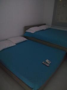 Postel nebo postele na pokoji v ubytování Acogedor apartamento en Girardot, fresco y tranquilo