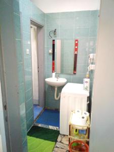 a small bathroom with a sink and a mirror at Apartments Jasmin in Goražde