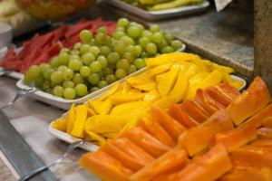 a display of fruits and vegetables on a counter at Hotel Regina Rio de Janeiro in Rio de Janeiro
