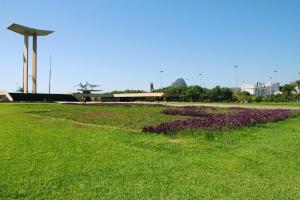 a park with purple flowers in the grass at Hotel Regina Rio de Janeiro in Rio de Janeiro