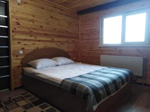 Кровать или кровати в номере Ольжича XXV