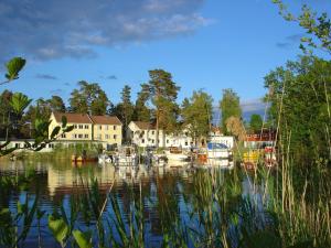 a group of boats are docked in a harbor at Solviken Tranås Hostel in Tranås