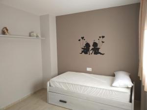Posteľ alebo postele v izbe v ubytovaní Apartamento San Carlos de la Rápita