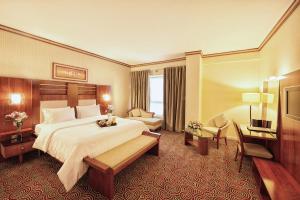 Postel nebo postele na pokoji v ubytování Grand Central Hotel
