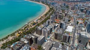 an aerial view of a city and the beach at Comfort Hotel Maceió in Maceió