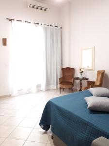 Postel nebo postele na pokoji v ubytování Casa Mia Miniapartment