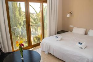 Postel nebo postele na pokoji v ubytování Hostal Gran Sol
