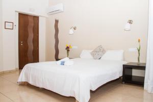 Postel nebo postele na pokoji v ubytování Hostal Gran Sol