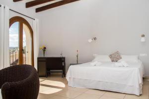 Postel nebo postele na pokoji v ubytování Hostal Gran Sol