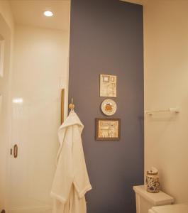 a bathroom with a toilet and a towel on the wall at Hill of Content B&B in Radiant +5 photos