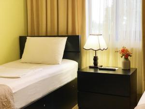 Voodi või voodid majutusasutuse Garden Hotel toas