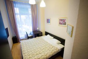 Cama ou camas em um quarto em Hotel Smolenka