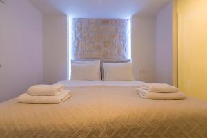 Postel nebo postele na pokoji v ubytování Palace Paulina Luxury Residence