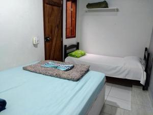 Postel nebo postele na pokoji v ubytování Albergue Muzy