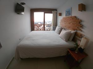 Llit o llits en una habitació de Bamboo Lodge Paracas