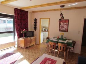 a kitchen and dining room with a table and chairs at Apartment Sophia in Seefeld in Tirol