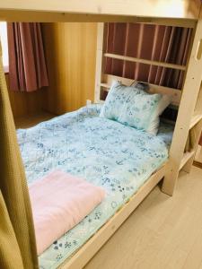 Ένα ή περισσότερα κρεβάτια σε δωμάτιο στο Guesthouse Perche Female Only