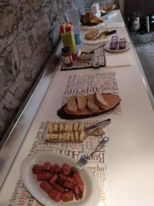 a buffet line with plates of food on display at Le Lanterne in Albavilla
