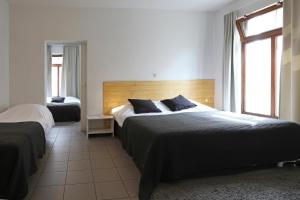Postel nebo postele na pokoji v ubytování Hotel De Loft + 37 fotografií