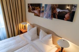 Postel nebo postele na pokoji v ubytování Hotel Olympic