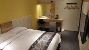Postel nebo postele na pokoji v ubytování Yi Yuan Homestay
