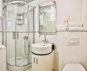 a bathroom with a sink and a shower at Zelen LUX in Sutomore +34 photos